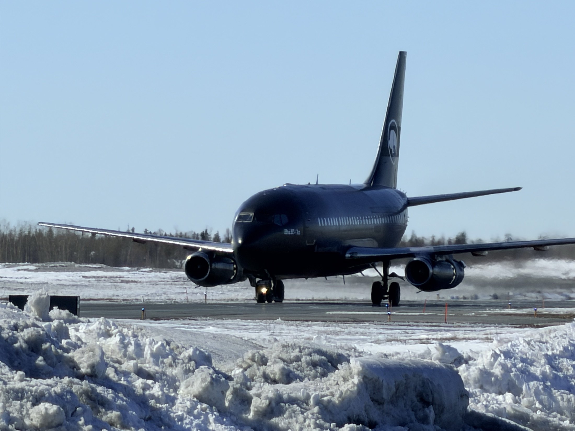 C-GTVO taxiing off the snowy runway after landing