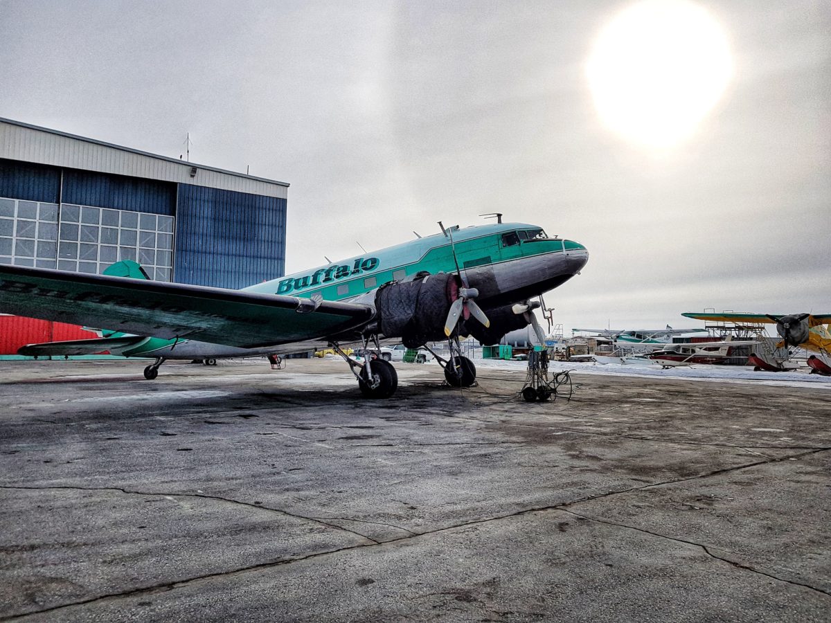 DC-3 outside the Yellowknife hangar in winter sun