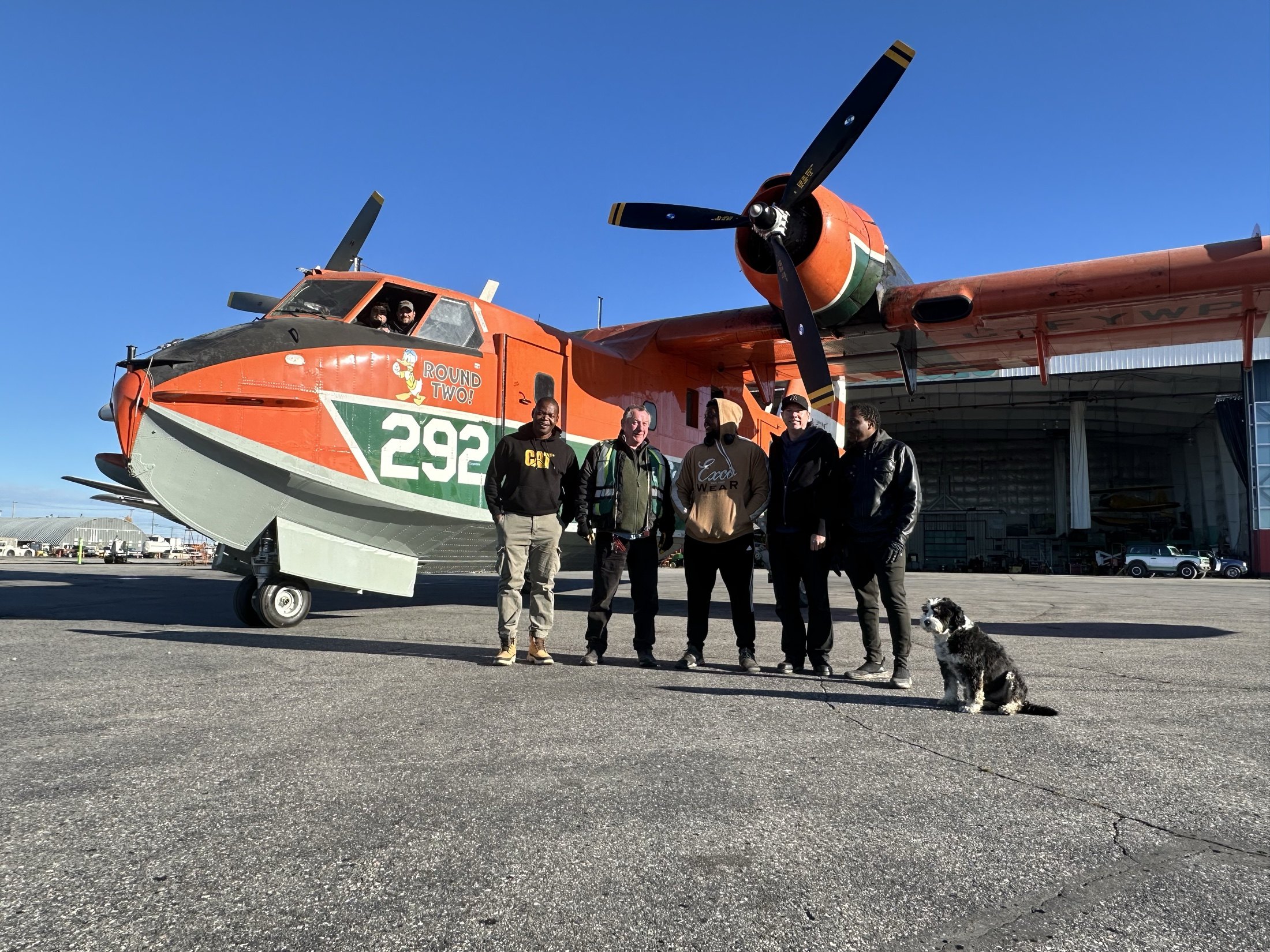 The crew and the dog in front of Tanker 292 before a ferry flight