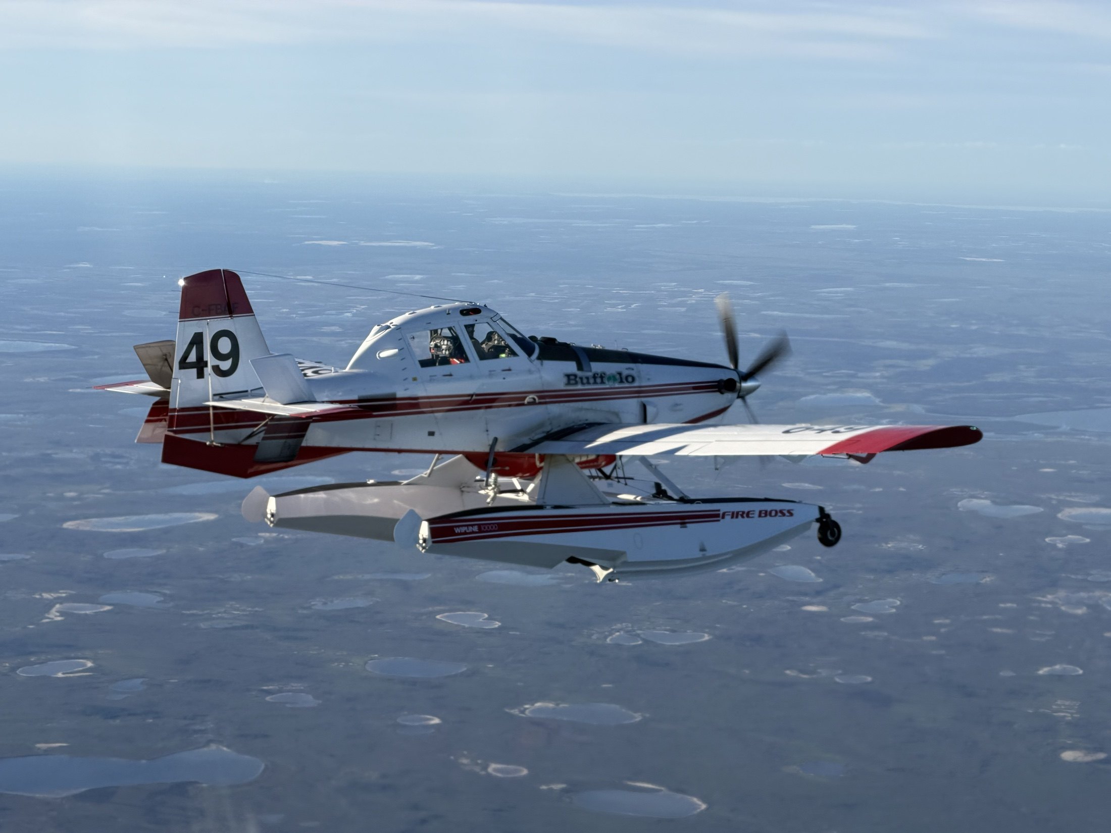 Fireboss 49 head-on in flight over the tundra lakes