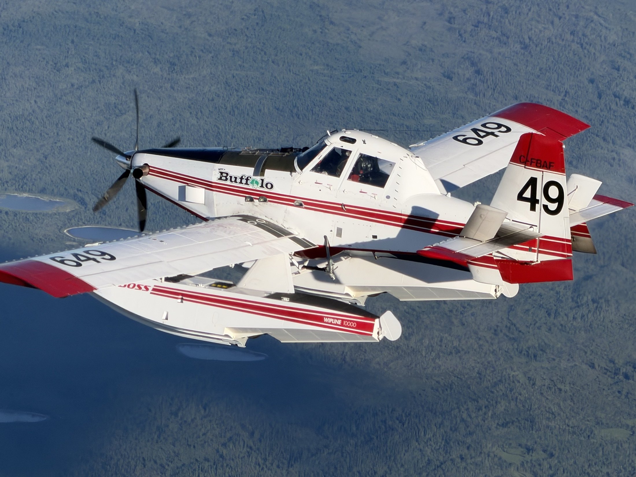 Tanker 649 banking over dark forest, floats and all