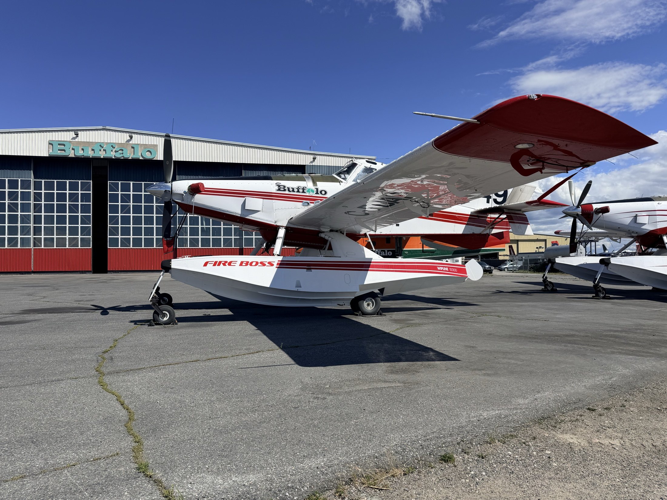 Fireboss 49 in front of the Buffalo hangar with more of the fleet beyond